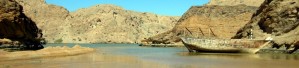 Oman beach and gulf with shipwreck